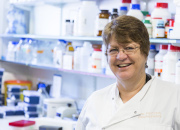 Jane Clarke in the lab smiling at camera