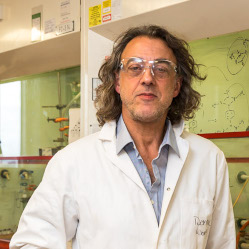 Prof Dom Wright in lab coat