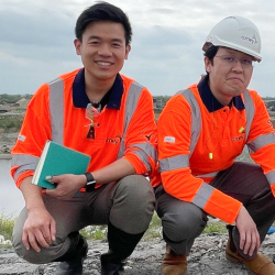 Chanon and Ariffin in visibility jackets on river