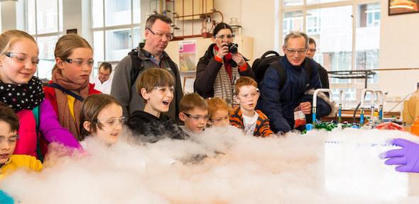 Children excitedly watching dry ice experiments