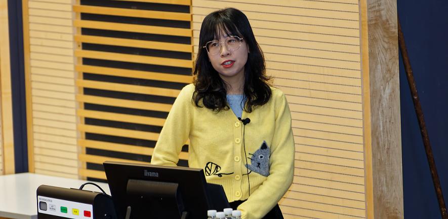 Scientist gives a talk. 
