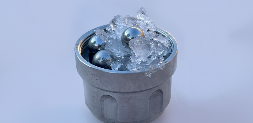 Ice and ball bearings in a metal cup.