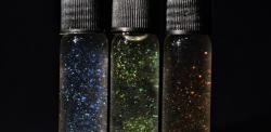 Three bottles of different coloured sustainable glitter