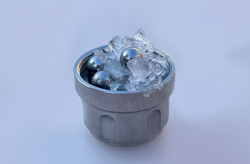 Ice and ball bearings in a metal cup.