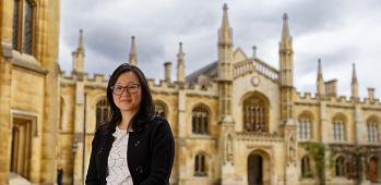 Jenny Zhang with Corpus Christi college in background, smiling at camera