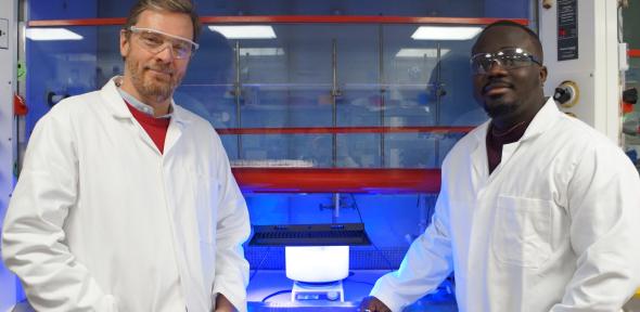 Erwin Reisner and Kay Kwarteng with the reactor. 