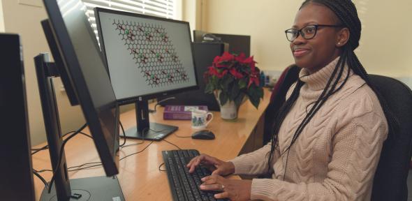 Inioluwa in front of the computer