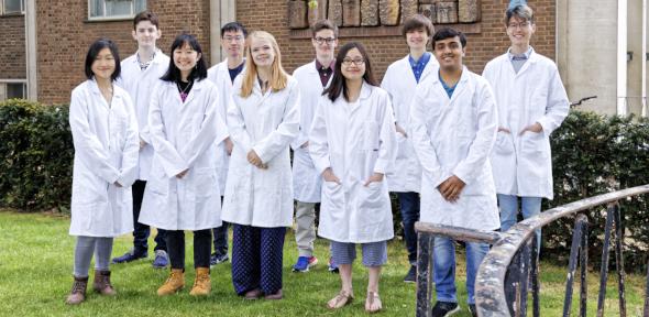 Members of the ChemSoc committee standing in a group wearing lab coats