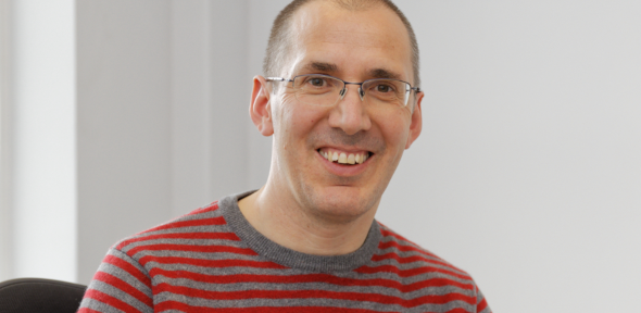 Head shot of Professor Michaelides smiling at camera