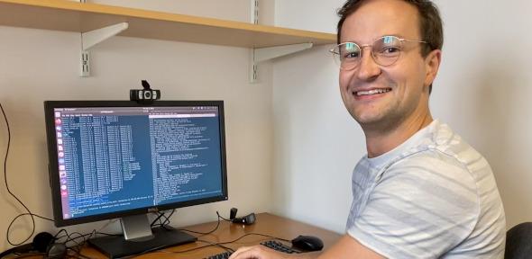 Image of Dr Christoph Schran sitting at his desk