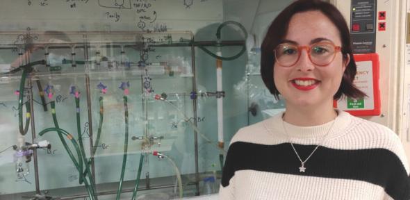 Yanira Mendez Gomez smiling at camera in lab