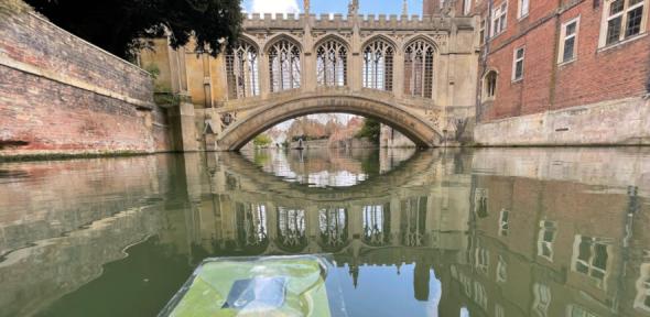 An artificial leaf floats on the River Cam near the Bridge of Sighs