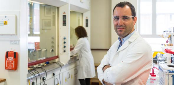 Professor Bernardes in lab smiling at camera