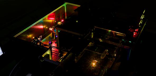 A microscope with multicoloured lights and lenses.