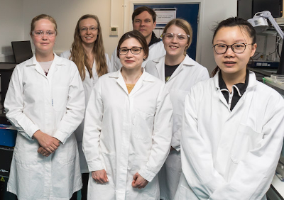 A group of postdocs in labcoats