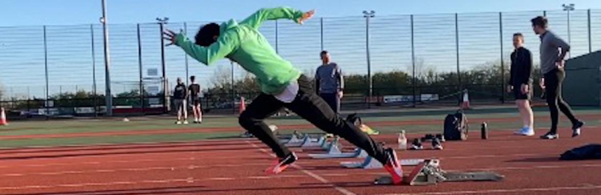 Chung Tu getting a fast start off the starting blocks on a track