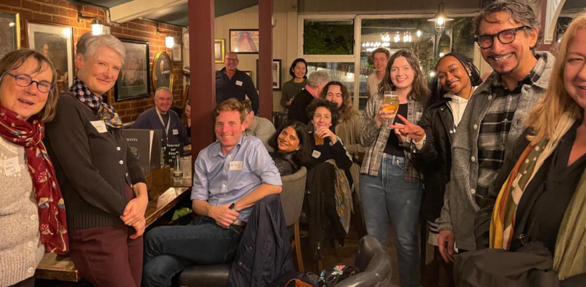 Group of mature students smiling at camera in the Granta pub