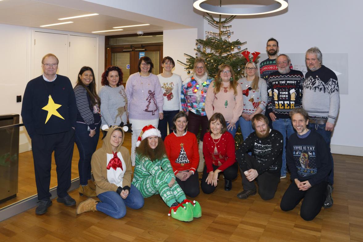 Members of the department wear their christmas jumpers.