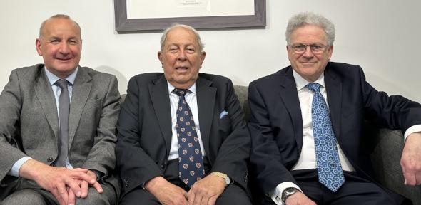James Keeler, Yusuf Hamied and Jeremy Sanders sitting on sofa in lobby