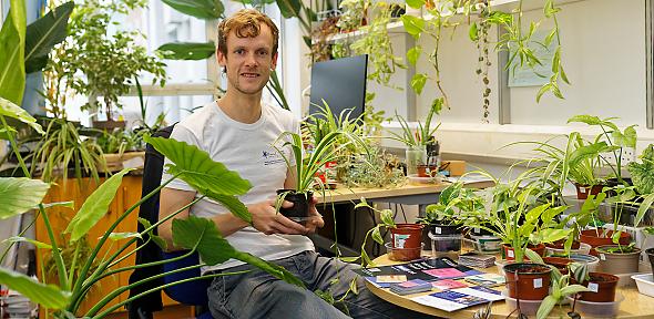 Alex Forse in front of plants