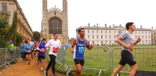 People running with King's College Chapel in the background