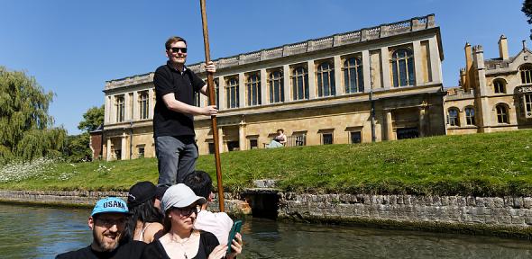 David Morgan punting a few smiling staff members on the Cam