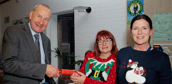 James Keeler pulling Christmas cracker with Kathleen Pickett and Sam Douglas