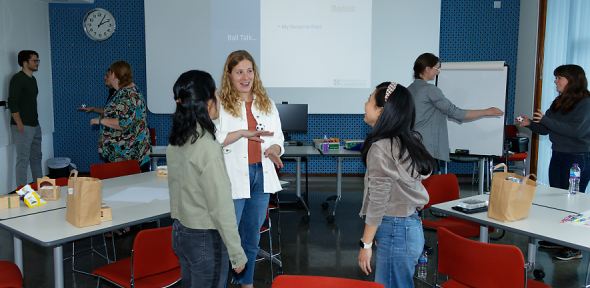 Postgrads chatting in the Todd Hamied room