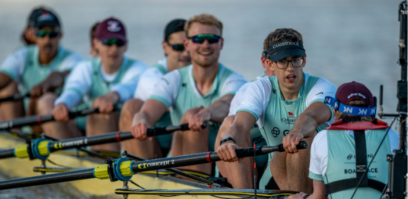 The Cambridge University Boat Club with Matthew Edge front right in a black cap.