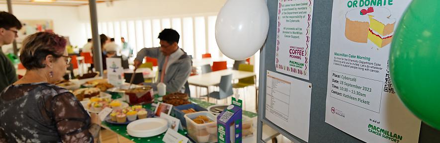 Chung Tu serving cakes at the Macmillan cake morning